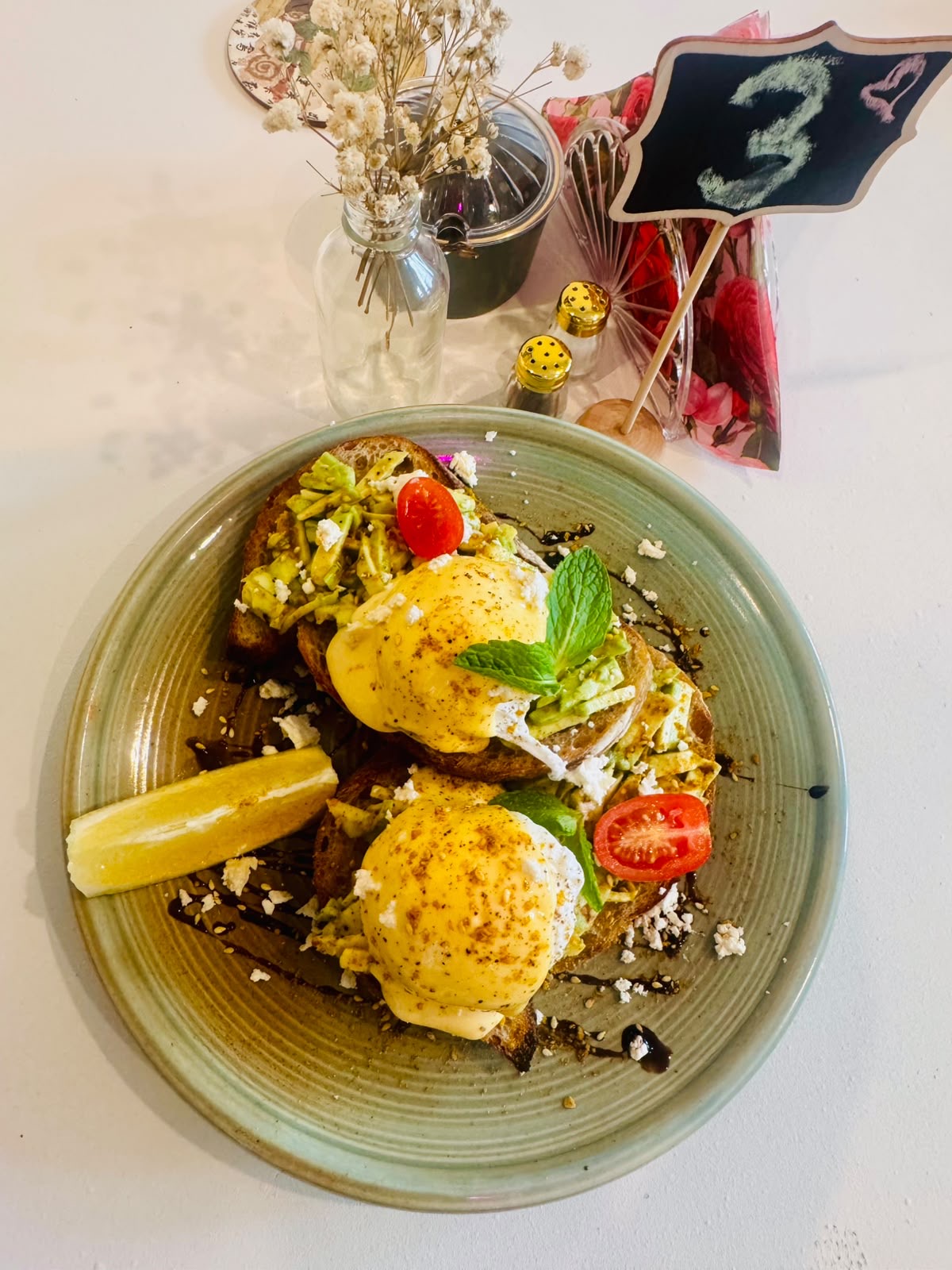 Eggs Benedict with avocado and fresh tomato