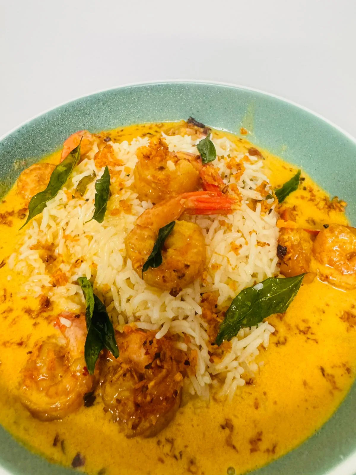 Creamy coconut prawns served with rice
