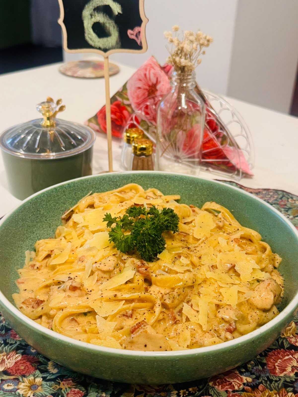 Creamy bacon carbonara topped with parmesan and parsley