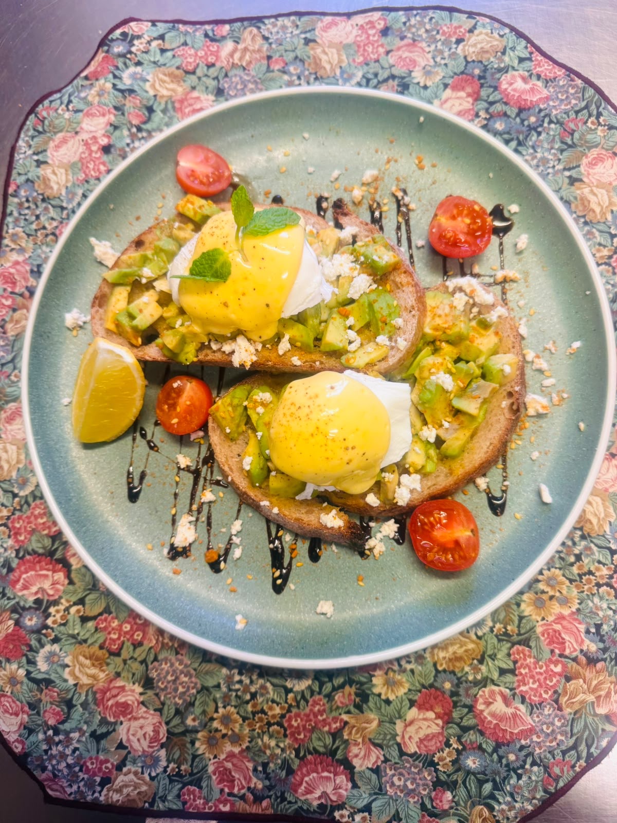 Poached eggs with hollandaise on avocado toast