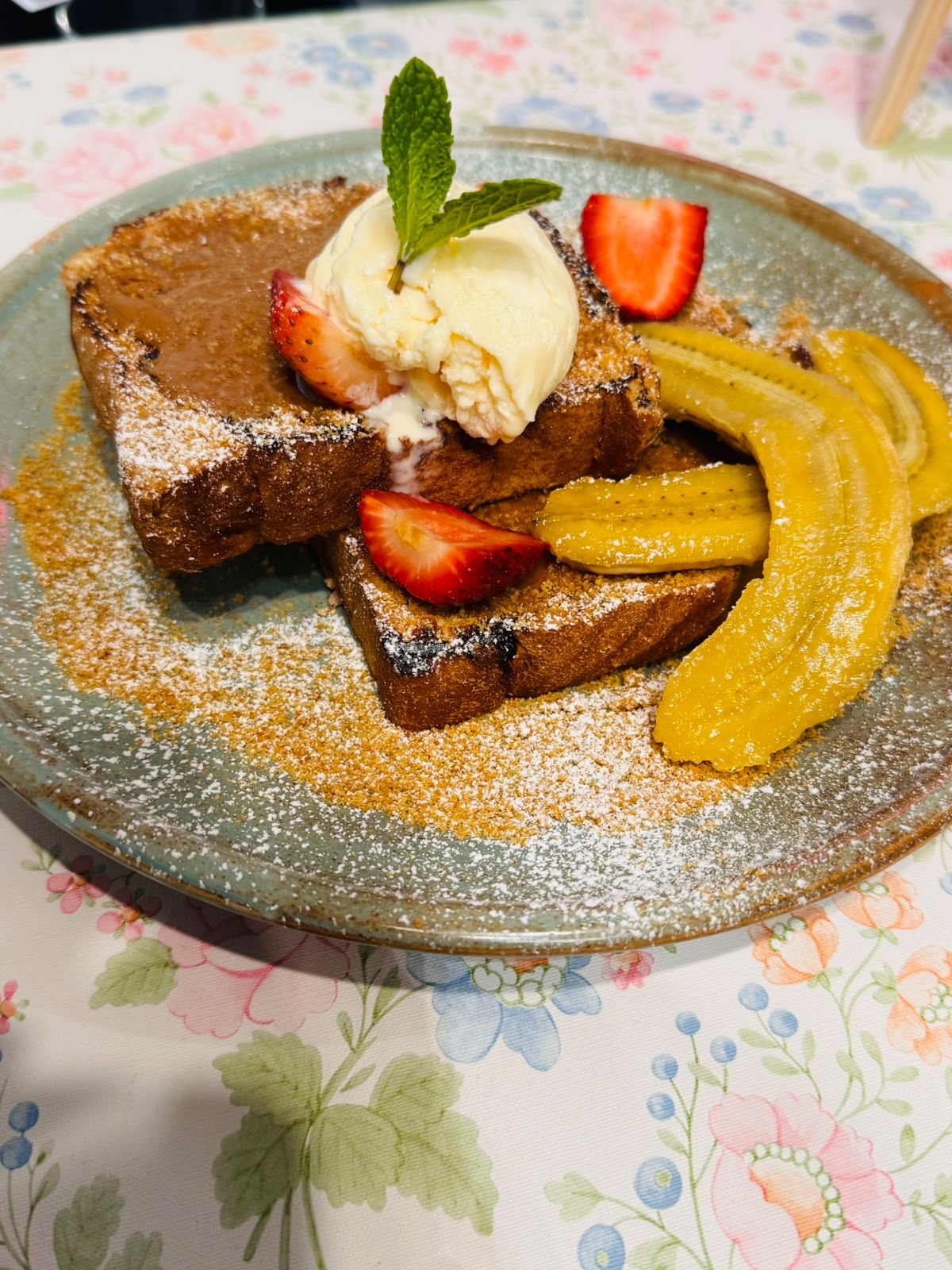 French toast with fresh strawberries, banana and ice cream